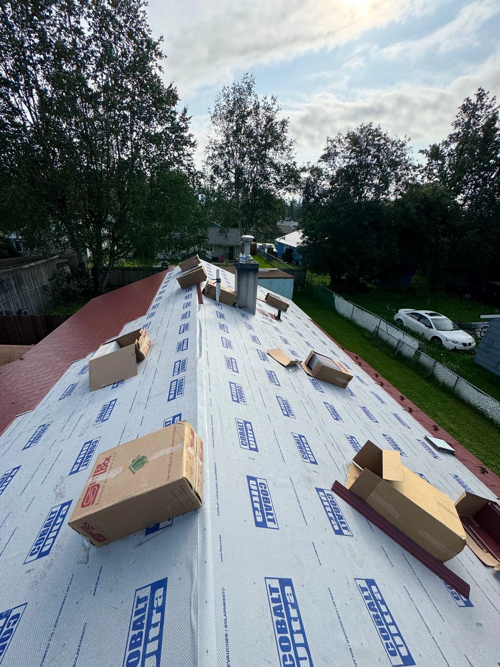 Interlock Aluminum Cedar Shingle Metal Roofing – Tile Red | Anchorage, AK (During installation)