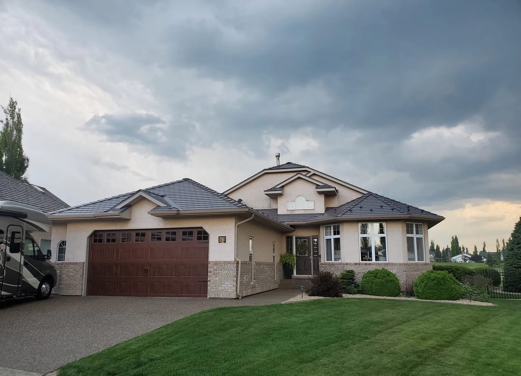 Weathered Interlock Slate aluminum roof on a tan ranch style home with a metal roof in a rural area, Red Deer, Alberta