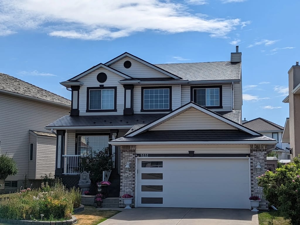 Deep Charcoal Interlock Slate aluminum roof on a Deep Charcoal Interlock Slate roof on a modern two-storey, Calgary, Alberta