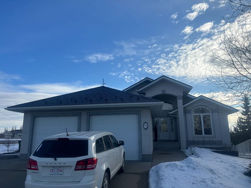 Black Interlock Slate aluminum roof on a white single-storey modern home with a dormer in the, Red Deer, Alberta
