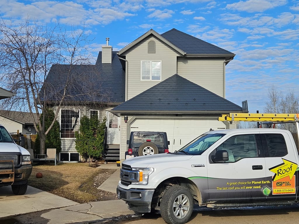 Deep Charcoal Interlock Slate aluminum roof on a two-storey home with a metal roof in Fort McMurray, Fort McMurray, Alberta