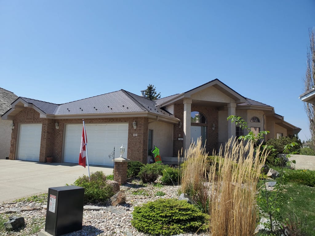 Colonial Brown Interlock Cedar Shingle aluminum roof on a Colonial brown single-family home in a suburban, Edmonton, Alberta