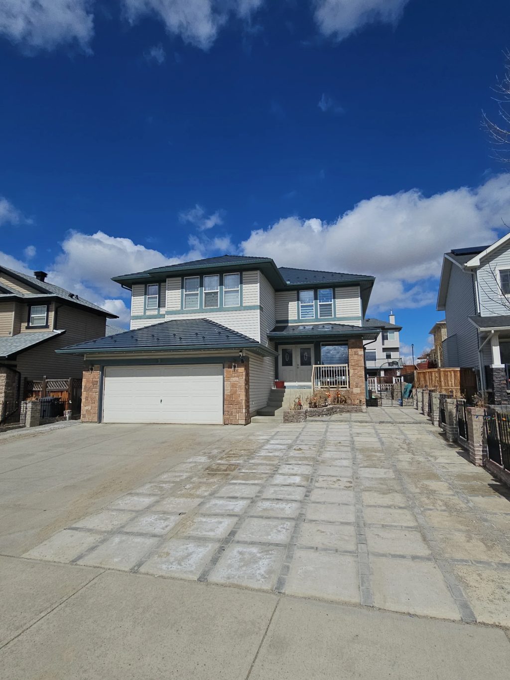 Deep Charcoal Interlock Slate aluminum roof on a Deep Charcoal metal roof on a two-storey Modern home in a, Chestermere, Alberta