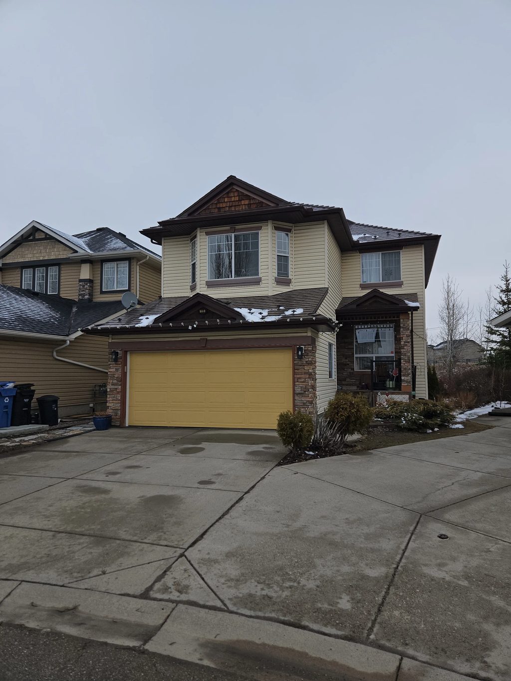 Colonial Brown Interlock Slate aluminum roof on a Colonial brown two-storey home with a brown roof among, Calgary, Alberta