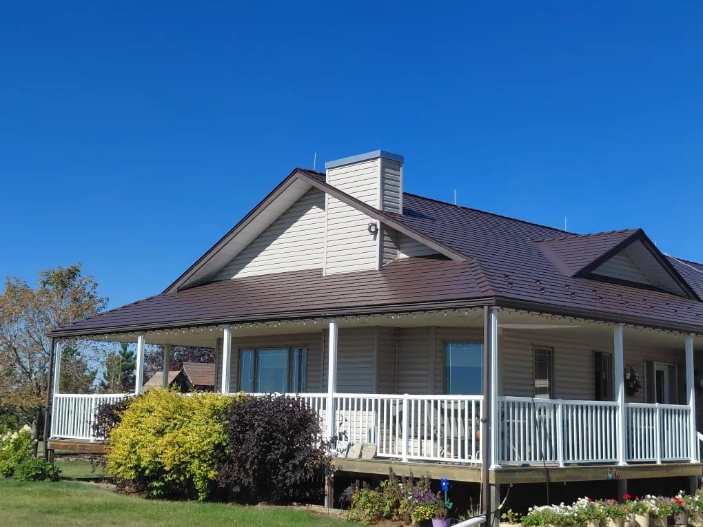 Colonial Brown Interlock Cedar Shingle aluminum roof on a Colonial brown roof on a one-storey home with a covered, Delia, Alberta