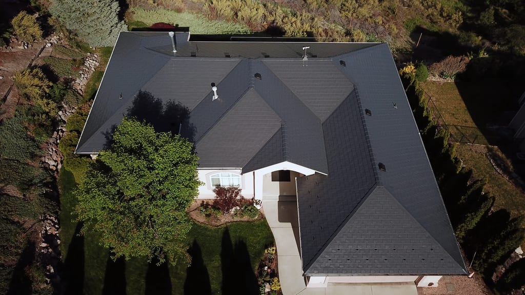 Deep Charcoal Interlock Slate aluminum roof on a large, single-storey home with an Interlock Slate metal, West Kelowna, British Columbia