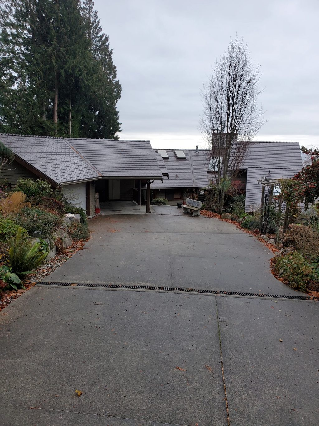Tudor Brown Interlock Slate aluminum roof on a Tudor style house with brown Interlock Slate metal roof, Roberts Creek, British Columbia