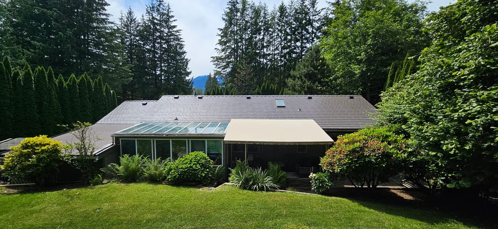 Tudor Brown Interlock Slate aluminum roof on a Tudor brown metal roof on a one-storey home among, Squamish, British Columbia