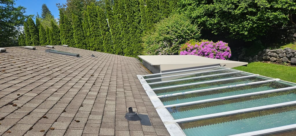 Before: a mossy asphalt shingle roof on the home, Squamish, British Columbia, ahead of a Tudor Brown Interlock Slate aluminum roof