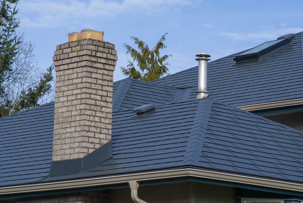 Deep Charcoal Interlock Slate aluminum roof on a deep charcoal metal roof on a single-family home in rural, Surrey, British Columbia