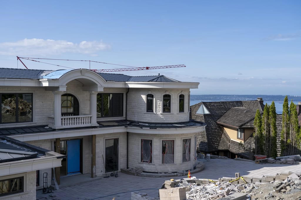 Deep Charcoal Interlock Slate aluminum roof being installed on the home, replacing new construction, West Vancouver, British Columbia