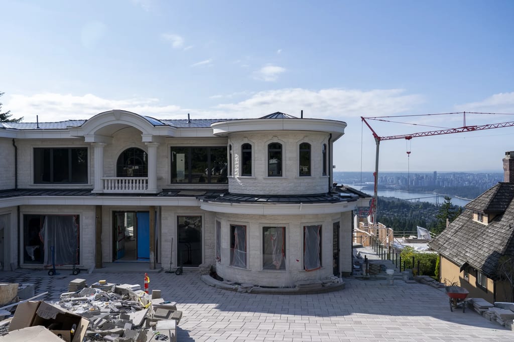 Deep Charcoal Interlock Slate aluminum roof being installed on the home, replacing new construction, West Vancouver, British Columbia