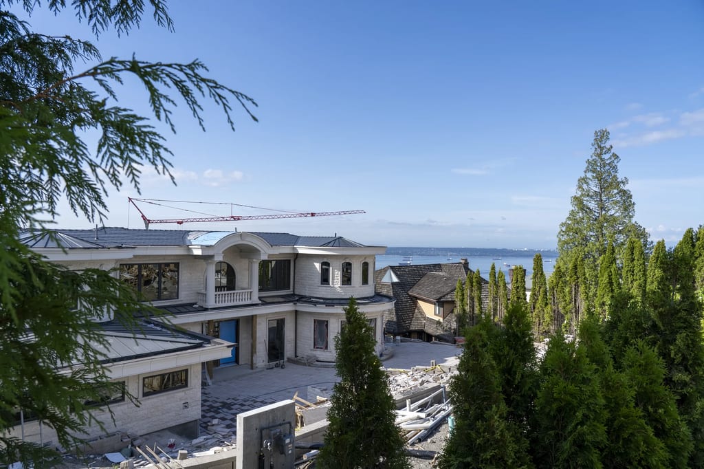Deep Charcoal Interlock Slate aluminum roof being installed on the home, replacing new construction, West Vancouver, British Columbia