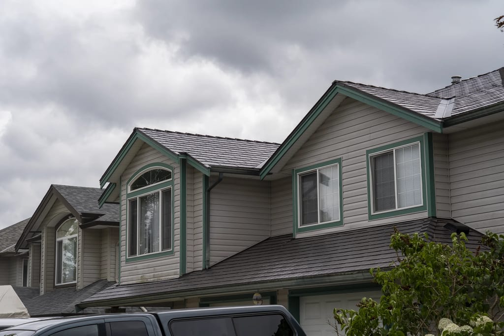 Tudor Brown Interlock Cedar Shingle aluminum roof on a Tudor home with a metal roof in Tudor Brown colour in an, Maple Ridge, British Columbia
