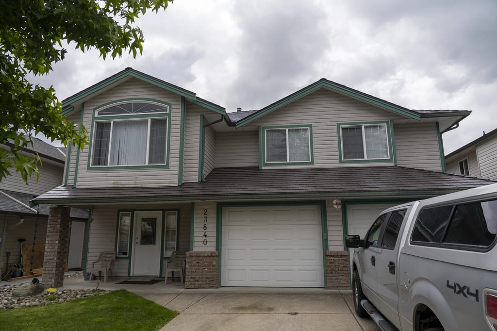 Tudor Brown Interlock Cedar Shingle aluminum roof on a Tudor style home with dormers in a rural suburban area, Maple Ridge, British Columbia