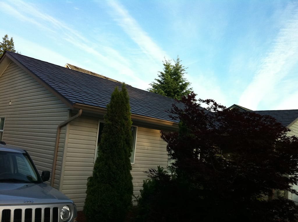Colonial Brown Interlock Slate aluminum roof on a Colonial home with a Colonial Brown metal roof in, Campbell River, British Columbia