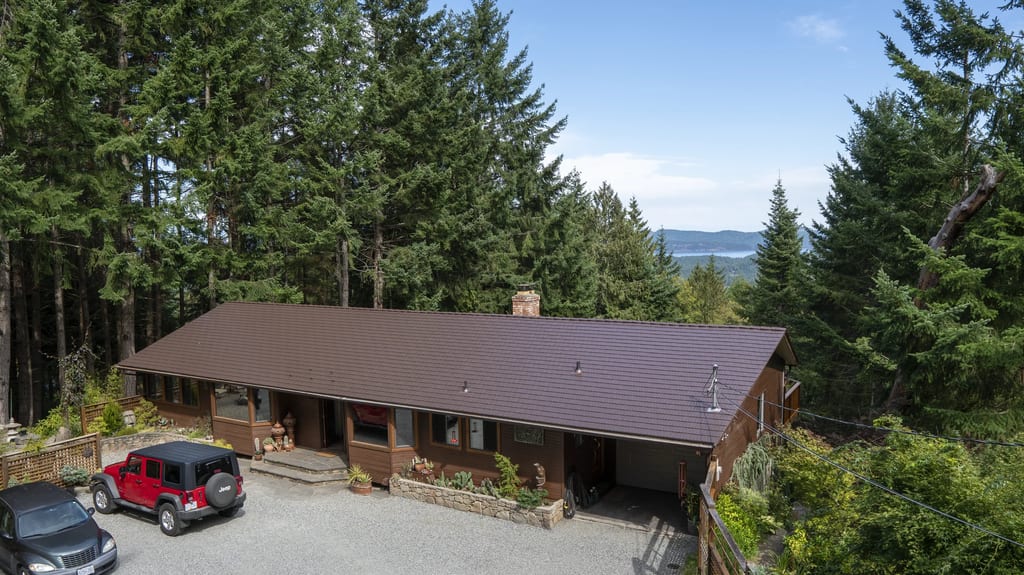 Colonial Brown Interlock Cedar Shingle aluminum roof on a Colonial brown metal roof on a single-family home in a, Salt Spring Island, British Columbia