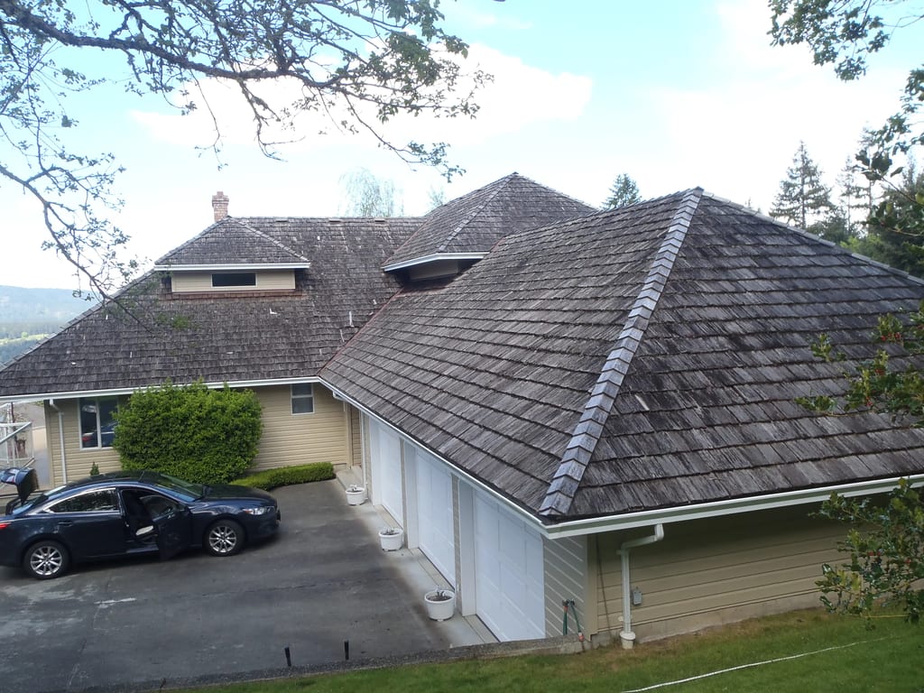 Before: a rotten wood shake roof on the home, Duncan, British Columbia, ahead of a Deep Charcoal Interlock Slate aluminum roof