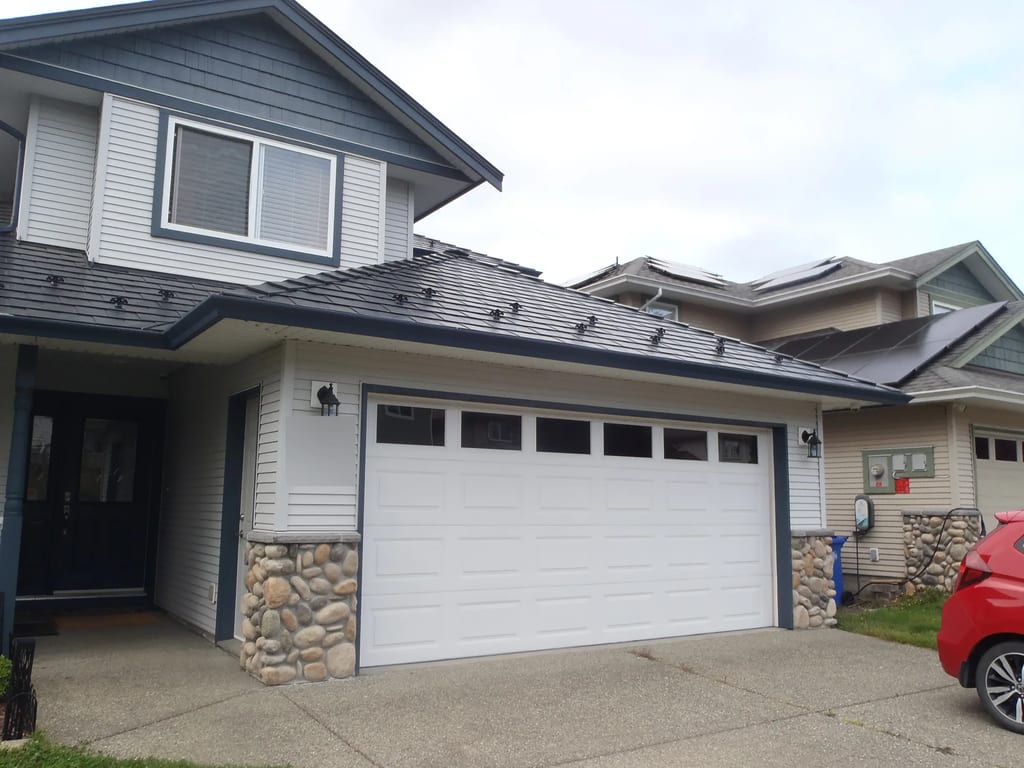 Black Interlock Slate aluminum roof on a two-storey home with a metal roof in Sooke, British, Sooke, British Columbia