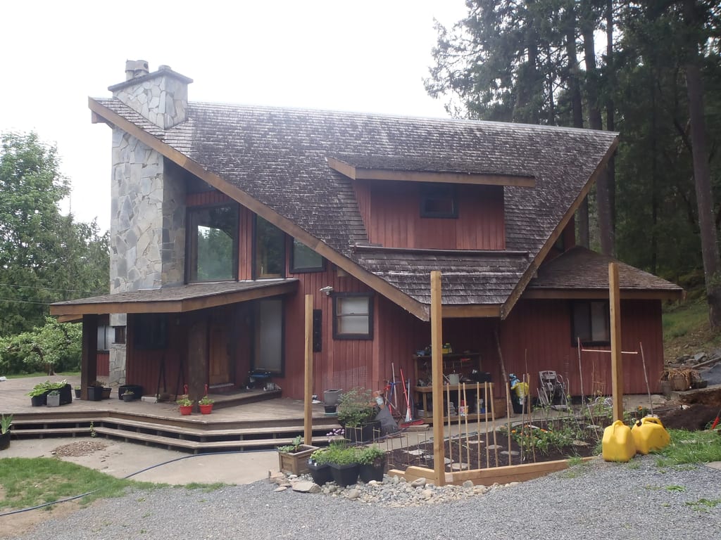 Before: a wood shake roof on the home, Shawnigan Lake, British Columbia, ahead of a Deep Charcoal Interlock Slate aluminum roof