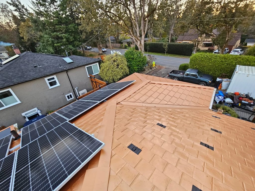Copper Penny Interlock Slate aluminum roof on a two-storey home with copper penny metal roof in a, Victoria, British Columbia