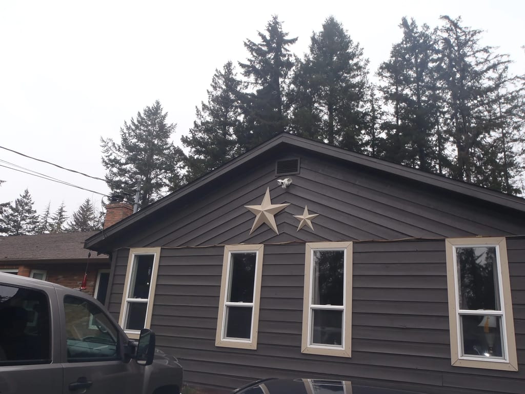 Before: a leaking asphalt shingle roof on the home, Comox, British Columbia, ahead of a Black Interlock Slate aluminum roof