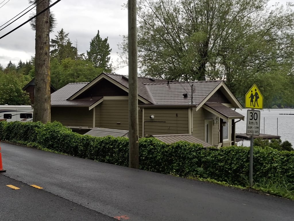 Colonial Brown Interlock Slate aluminum roof on a brown single-family home with Colonial style and a, Shawnigan Lake, British Columbia