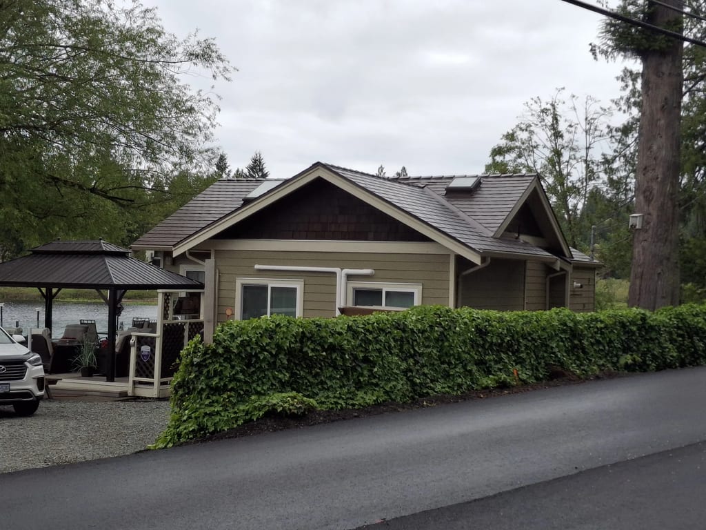 Colonial Brown Interlock Slate aluminum roof on a Colonial home with a Colonial Brown metal roof near a lake, Shawnigan Lake, British Columbia