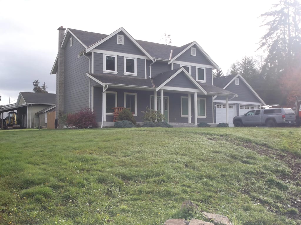 Before: a leaking asphalt shingle roof on the home, Sooke, British Columbia, ahead of a Black Interlock Slate aluminum roof