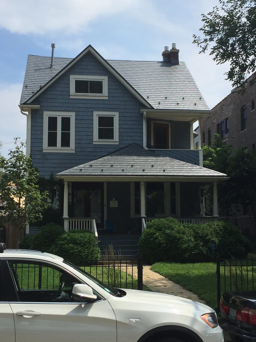 Charcoal Grey Interlock Slate aluminum roof on a two-storey home with dormers in a residential, Chicago, Illinois
