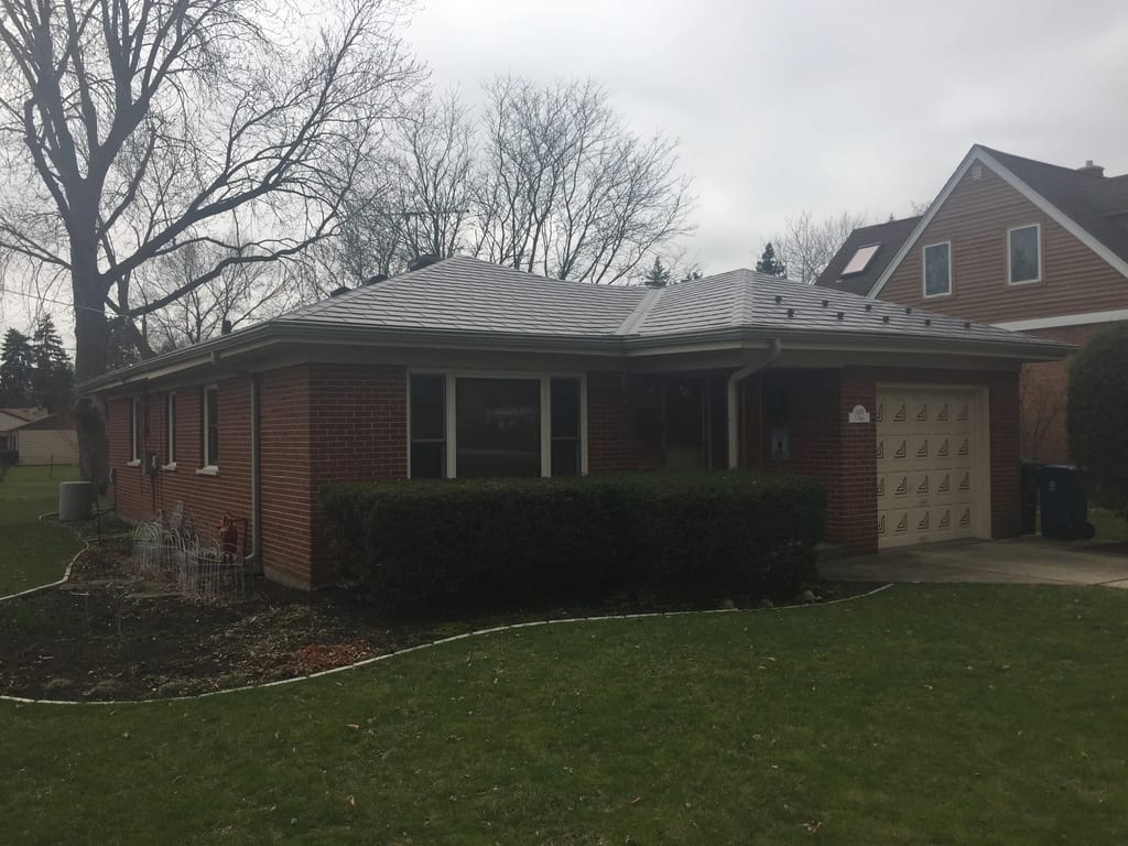 Colonial Brown Interlock Slate aluminum roof on a colonial brown metal roof on a red brick home in a, Des Plaines, Illinois