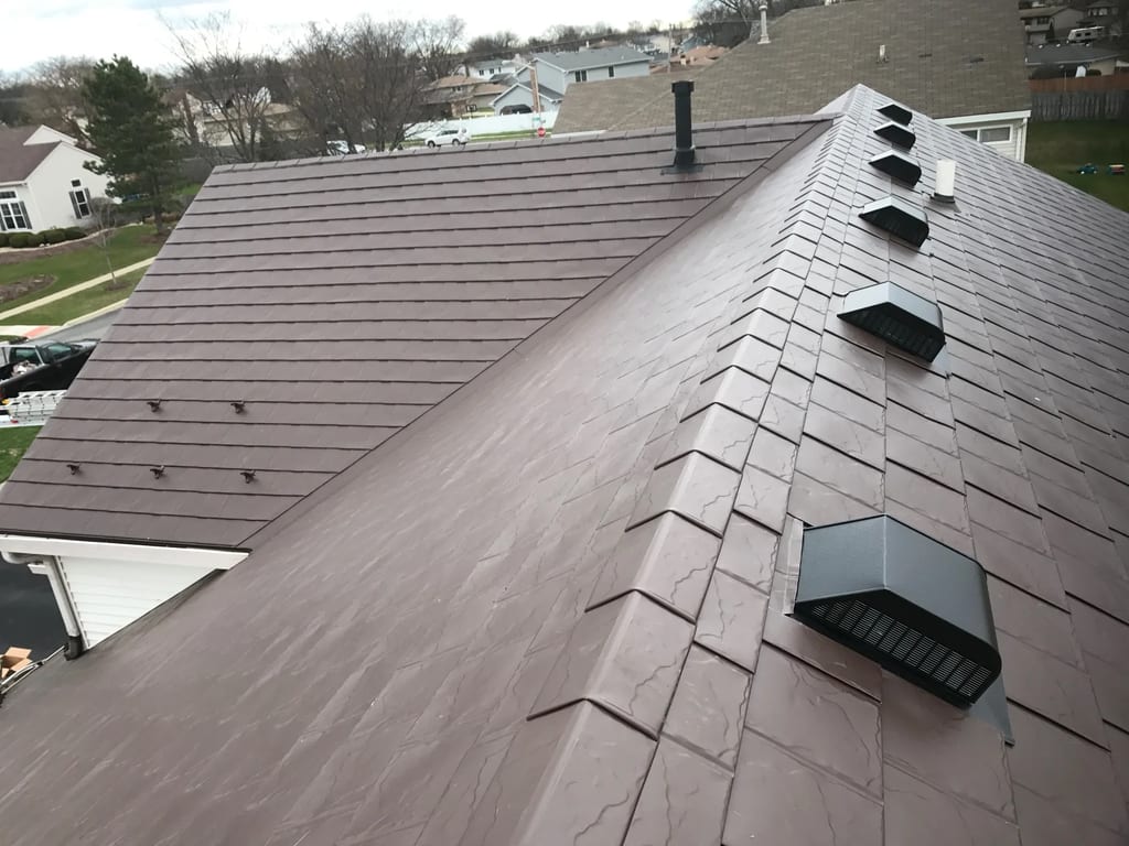Colonial Brown Interlock Slate aluminum roof on a brown two-storey home with a Colonial style and dormers, Carol Stream, Illinois