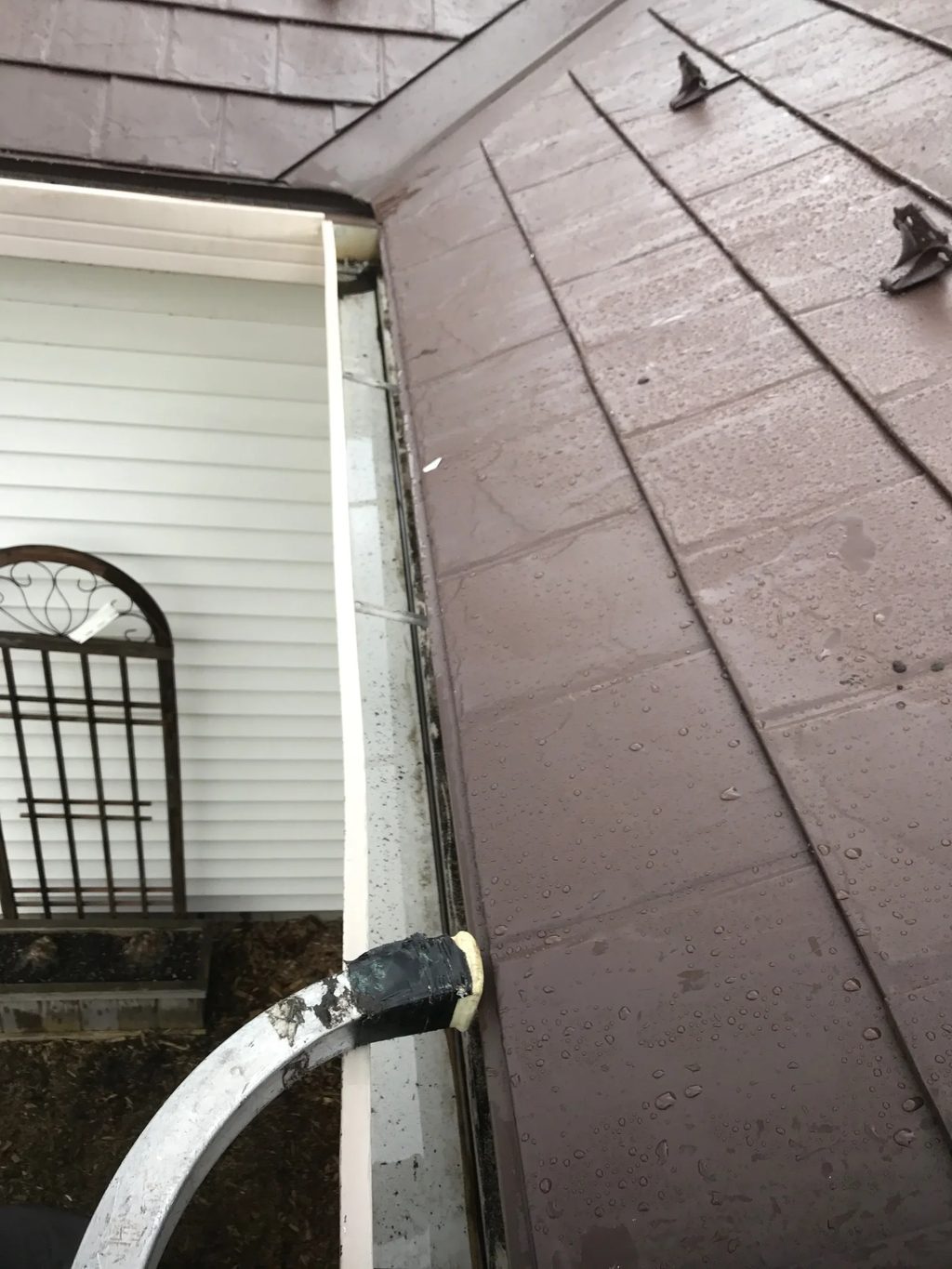 Colonial Brown Interlock Slate aluminum roof being installed on the home, replacing a worn out asphalt shingle roof, Carol Stream, Illinois