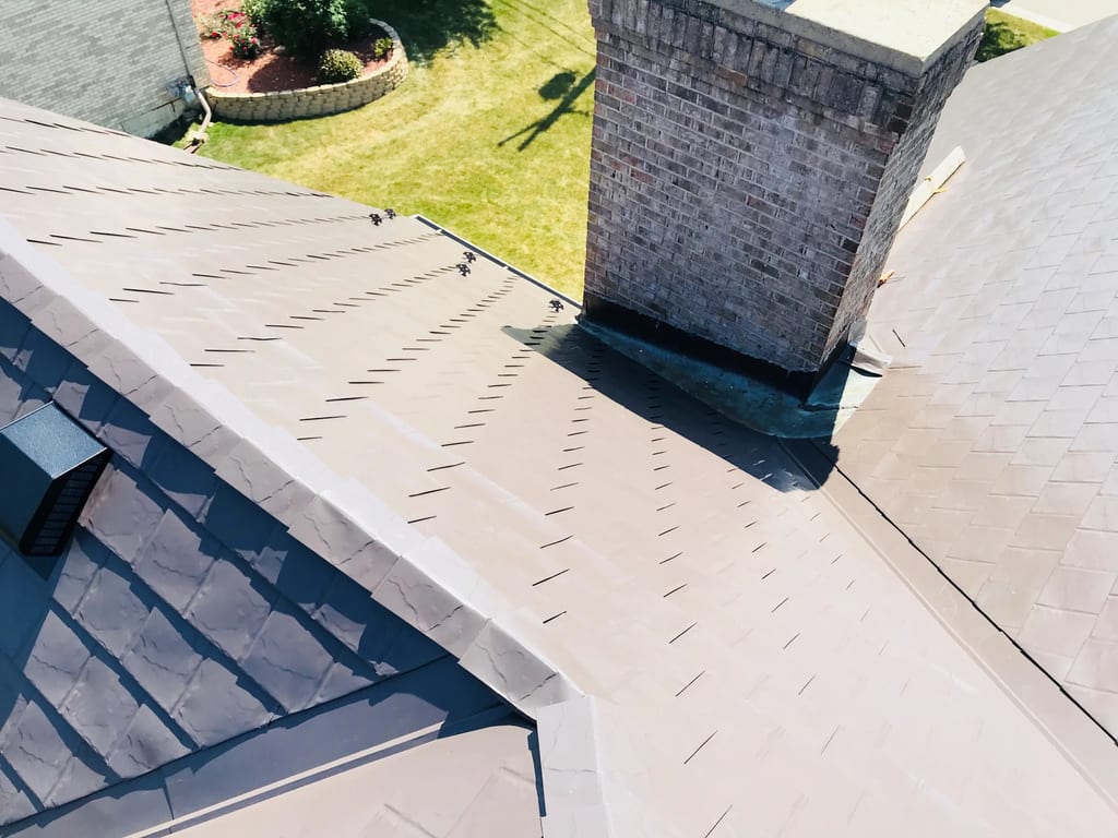 Tudor Brown Interlock Slate aluminum roof on a Tudor brown metal roof on a colonial style house in a, Roselle, Illinois