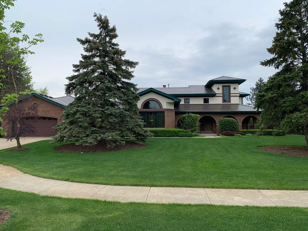 Colonial Brown Interlock Cedar Shingle aluminum roof on a colonial home with a brown metal roof in a suburban, Orland Park, Illinois