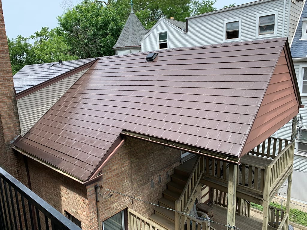 Colonial Brown Interlock Slate aluminum roof on a brown two-storey home with dormers in an urban setting, Chicago, Illinois