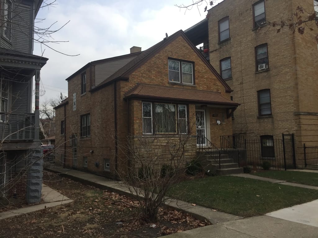 Before: a leaking asphalt shingle roof on the home, Chicago, Illinois, ahead of a Colonial Brown Interlock Slate aluminum roof