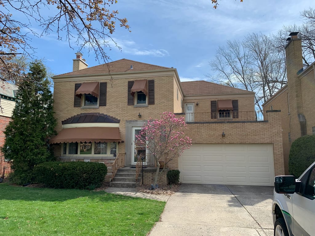 Before: a leaking asphalt shingle roof on the home, River Forest, Illinois, ahead of a Colonial Brown Interlock Slate aluminum roof