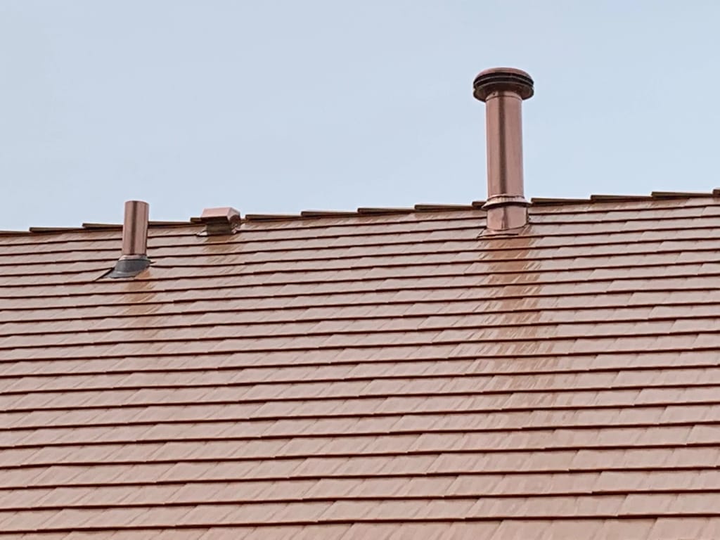 Copper Penny Interlock Cedar Shingle aluminum roof on a copper penny metal roof on a single-family home in a, Bolingbrook, Illinois