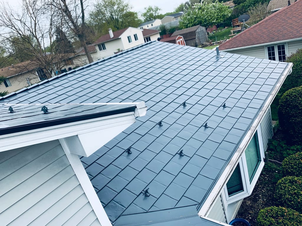 Deep Charcoal Interlock Slate aluminum roof on a single-family home with a deep charcoal metal roof in, Elgin, Illinois