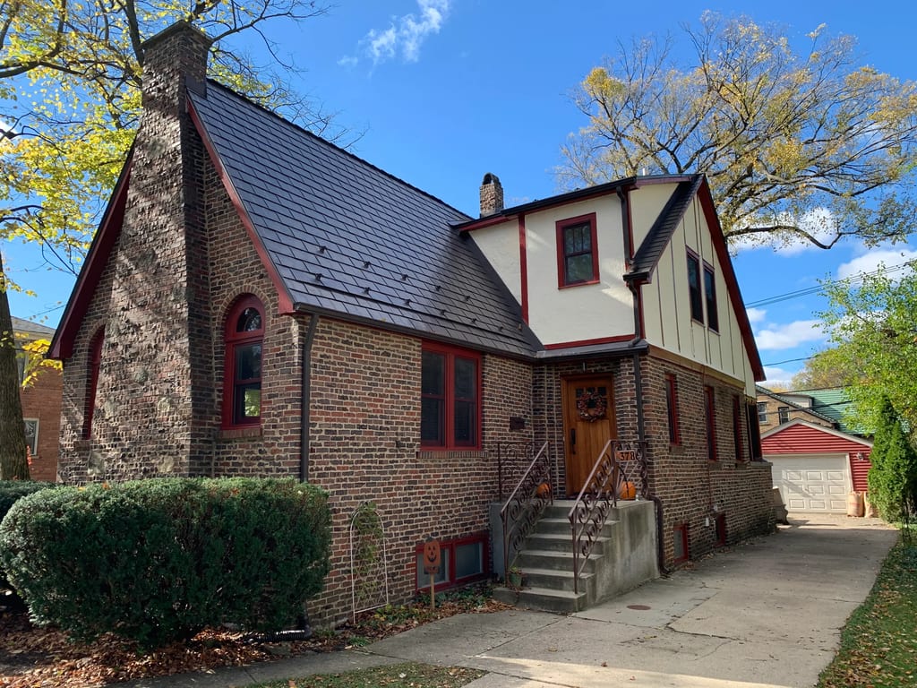 Tudor Brown Interlock Slate aluminum roof on a Tudor brown metal roof on a two-storey brick home in a, Elmhurst, Illinois