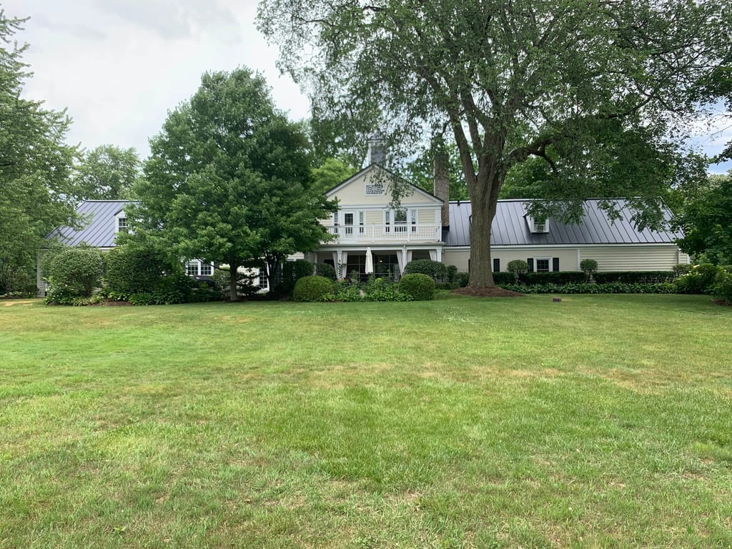Black Interlock Standing Seam aluminum roof on a colonial home with a metal roof on a forested rural, Lake Forest, Illinois