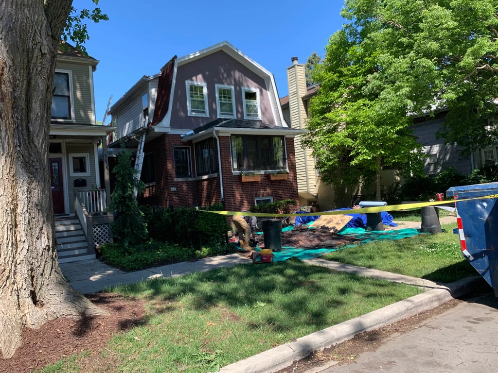 Black Interlock Slate aluminum roof being installed on the home, replacing a worn out asphalt shingle roof, Oak Park, Illinois