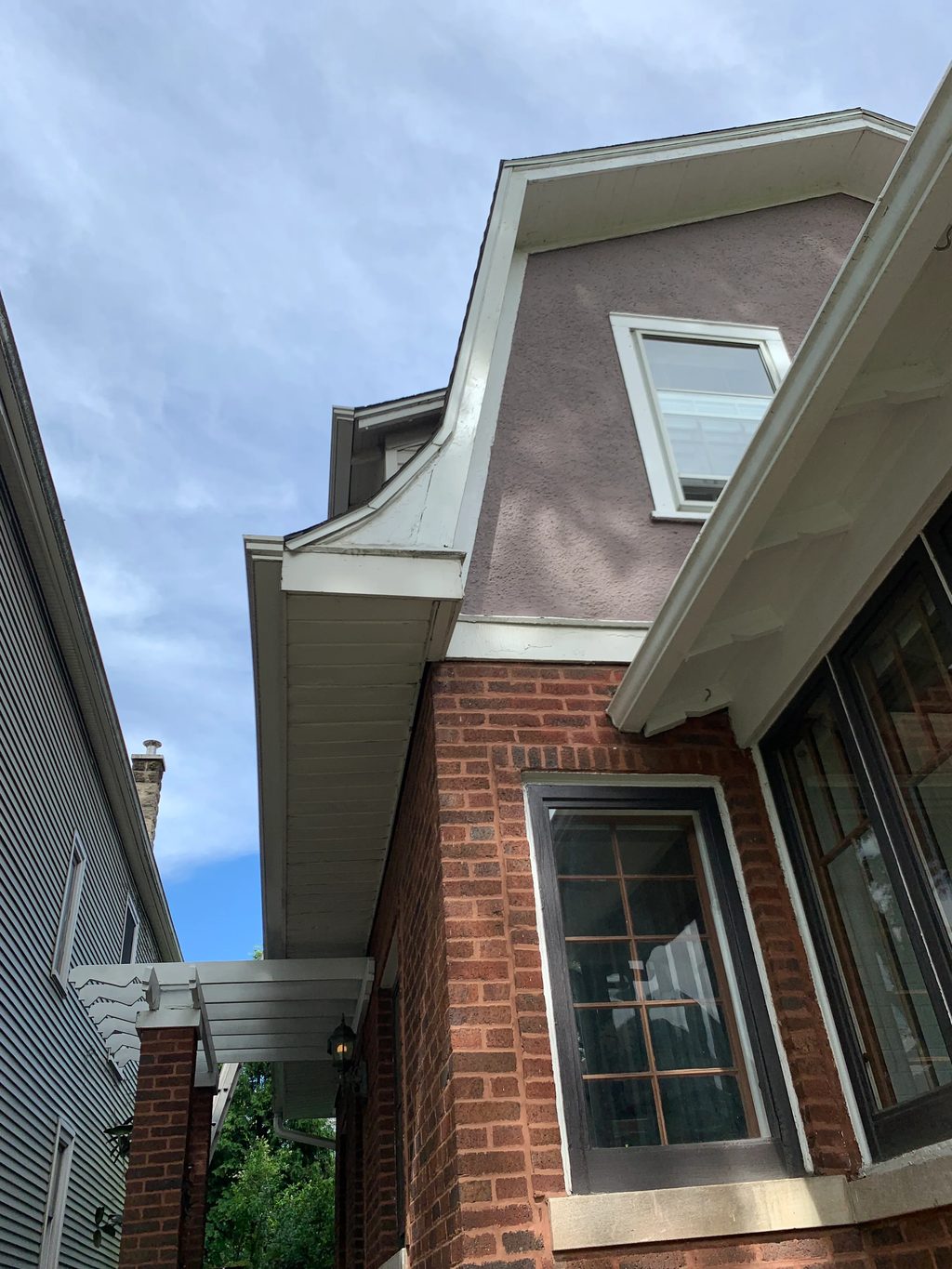 Black Interlock Slate aluminum roof being installed on the home, replacing a worn out asphalt shingle roof, Oak Park, Illinois