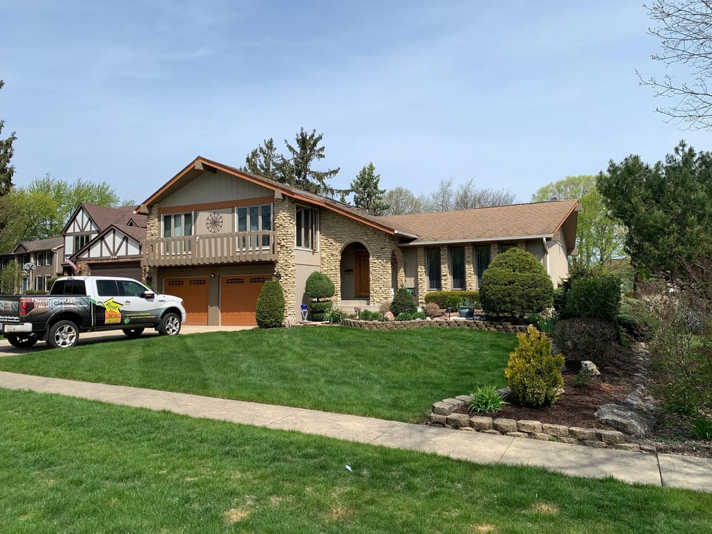 Before: a worn out asphalt shingle roof on the home, Bartlett, Illinois, ahead of a Tudor Brown Interlock Cedar Shingle aluminum roof