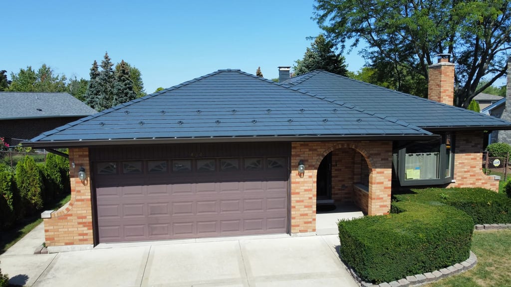 Deep Charcoal Interlock Slate aluminum roof on a Deep Charcoal metal roof on a brick ranch in a suburban, Westmont, Illinois