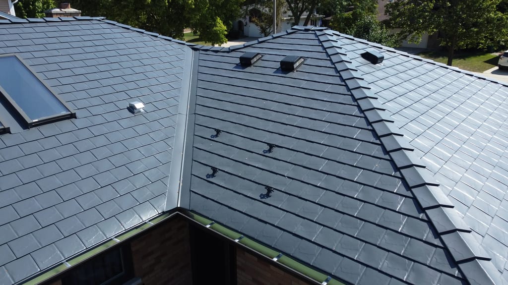 Deep Charcoal Interlock Slate aluminum roof on a deep charcoal metal roof on a suburban home with lush, Westmont, Illinois