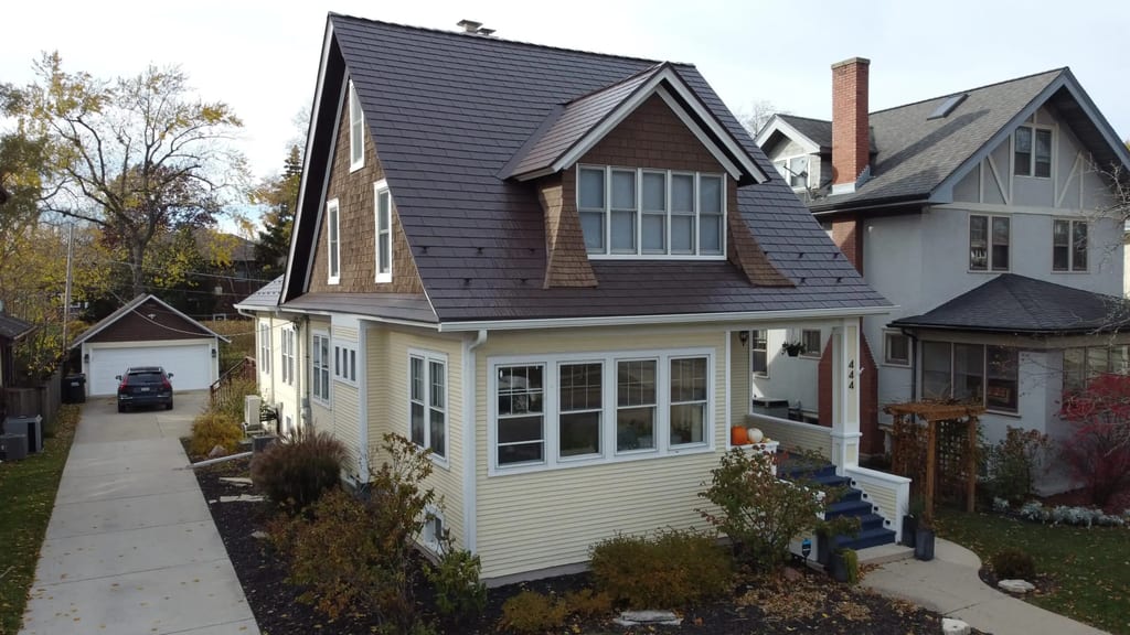 Aerial view of a Craftsman-style home in La Grange, IL featuring Interlock Colonial Brown cedar shingle aluminum roofing with multiple dormers and complex roofline.