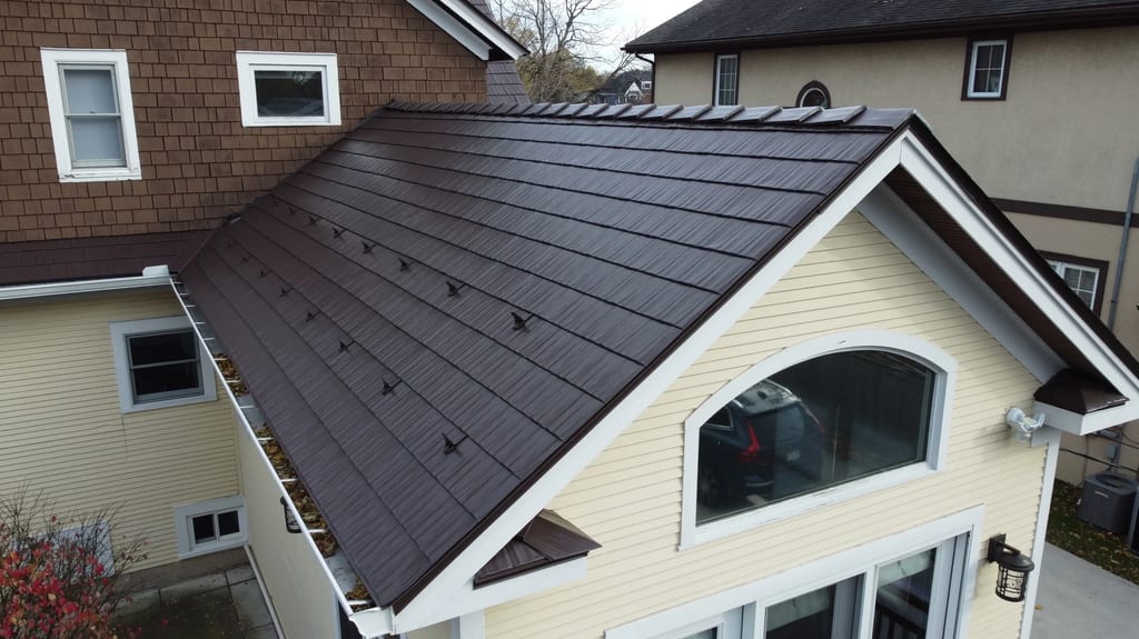 Colonial Brown Interlock Cedar Shingle aluminum roof on a cream two-storey home with dormers in a rural suburban, La Grange, Illinois