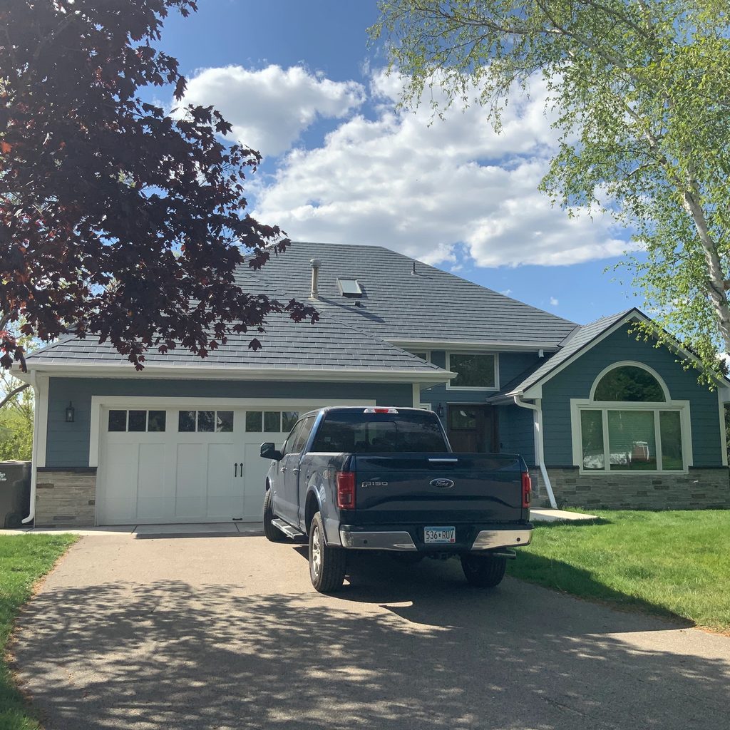 Deep Charcoal Interlock Slate aluminum roof on a two-storey home with dormers in a suburban setting, Eden Prairie, Minnesota